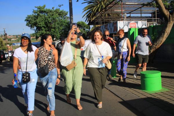 Guests on Soweto Half Day Tour walking in Soweto