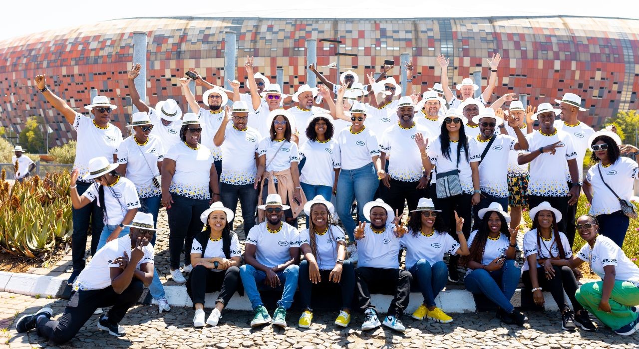 Picture of group of guests in front of stadium